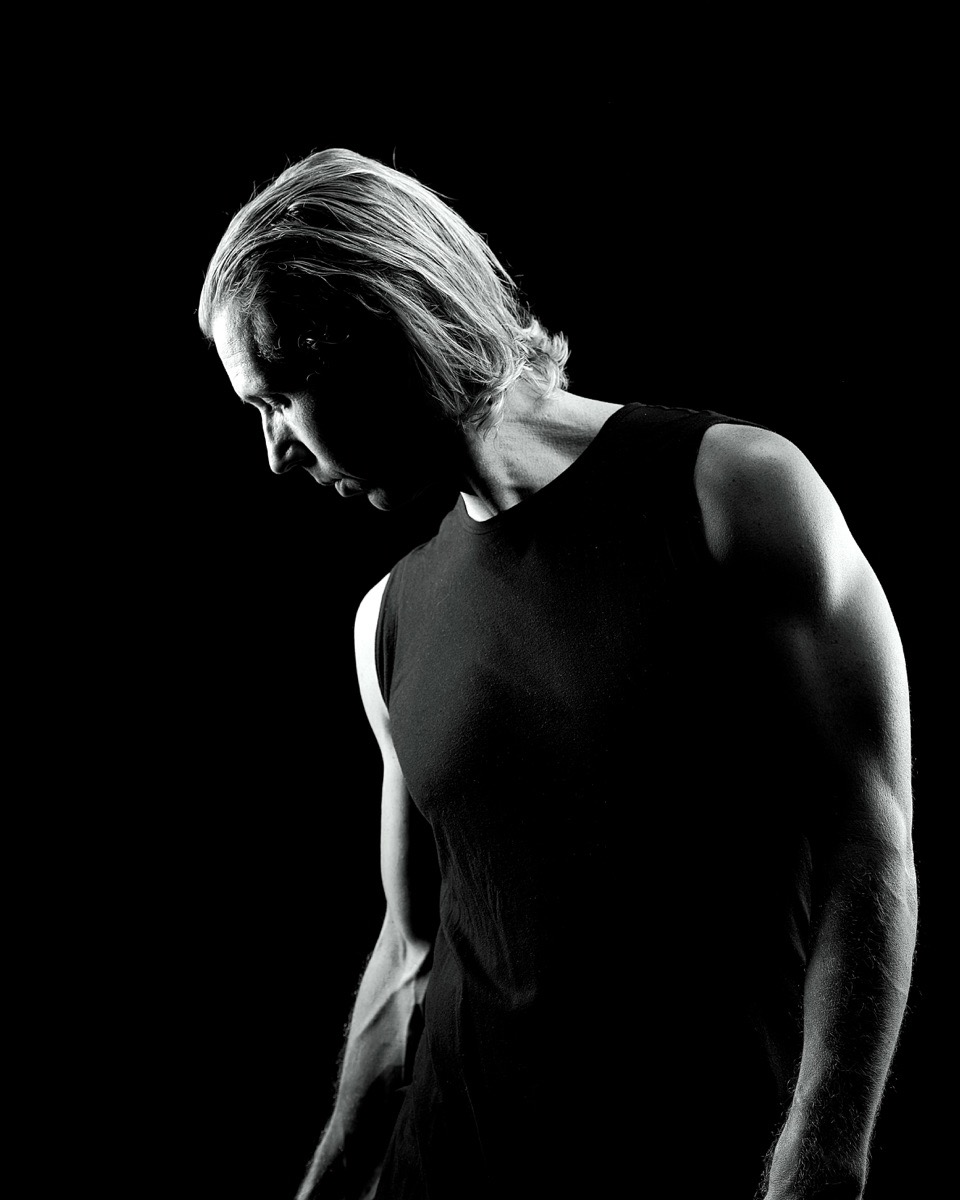 Indiana Bradley looking down in dramatic black and white light